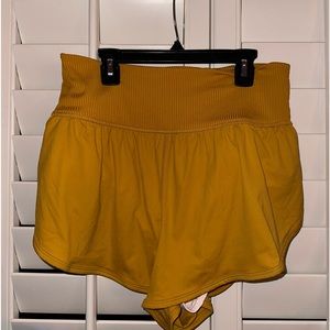 Free People Movement “Game Time” Shorts in Mustard Yellow